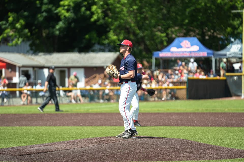 Lower Columbia pitcher holding the ball and glove on the mound